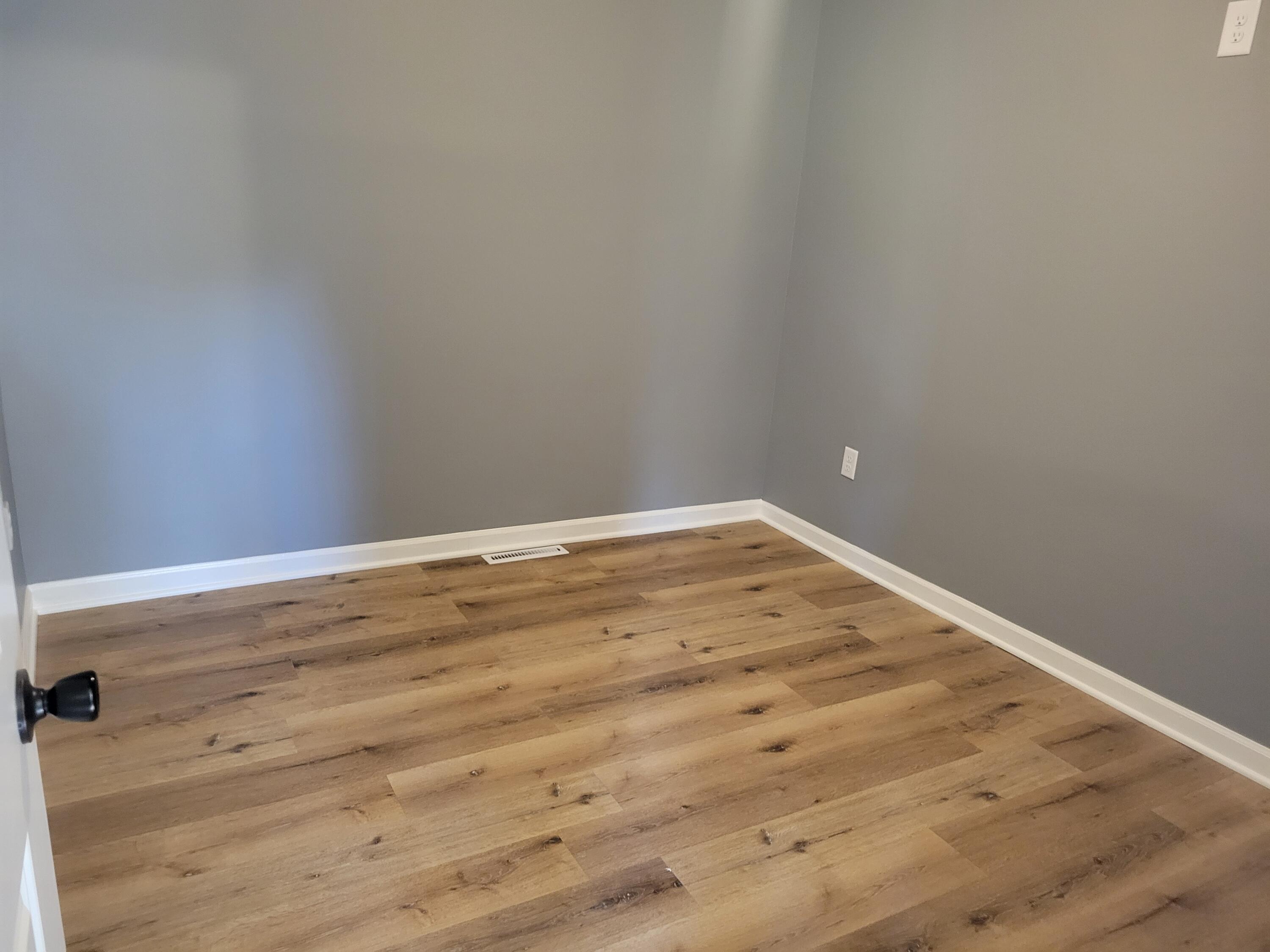 4738 Delaware Street Gary, IN 46409 - Photo 8 of 14 a view of empty room with wooden floor