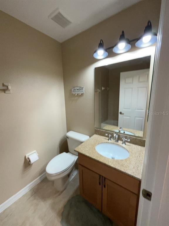 839 Assembly Court Reunion, FL 34747 - Photo 11 of 16 a bathroom with a sink and a mirror