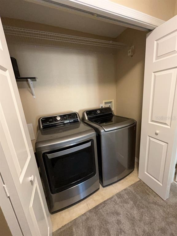 839 Assembly Court Reunion, FL 34747 - Photo 12 of 16 a utility room with dryer and washer