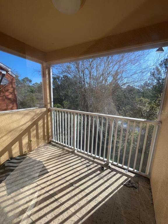 839 Assembly Court Reunion, FL 34747 - Photo 16 of 16 a view of a balcony with wooden floor and fence