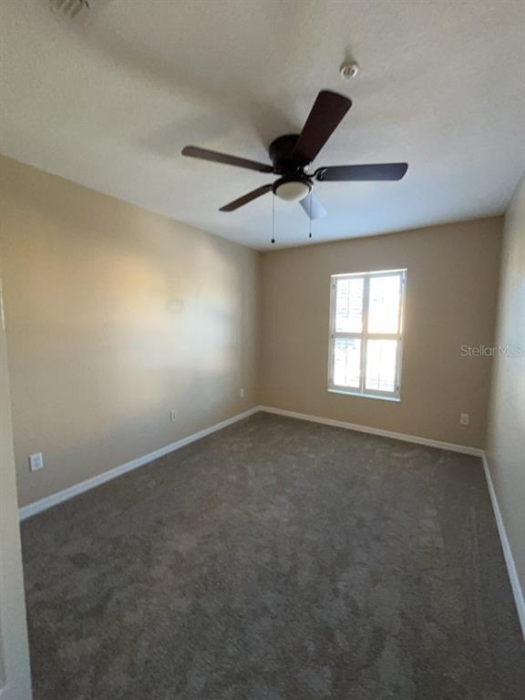 839 Assembly Court Reunion, FL 34747 - Photo 10 of 16 a view of an empty room with a window