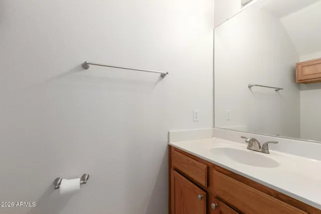 a bathroom with a sink and vanity