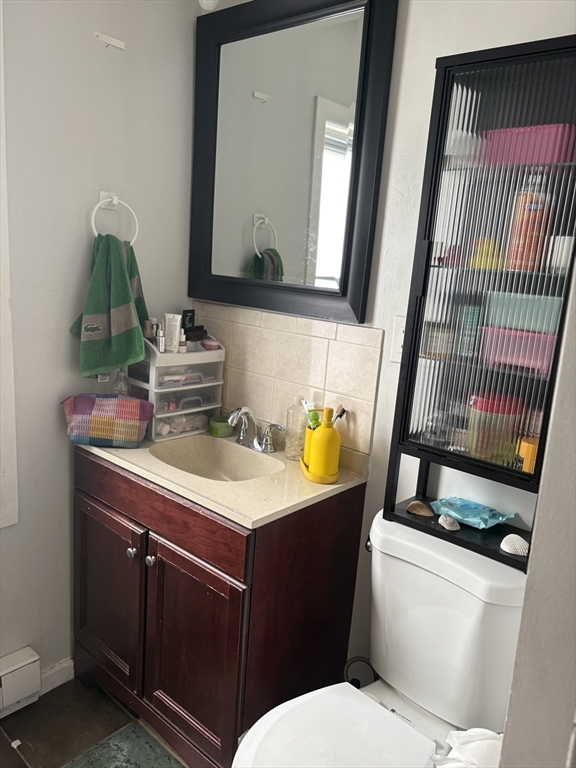 19 Wolcott Street, Unit 3 Boston, MA 02121 - Photo 13 of 17 a bathroom with a sink a toilet and mirror