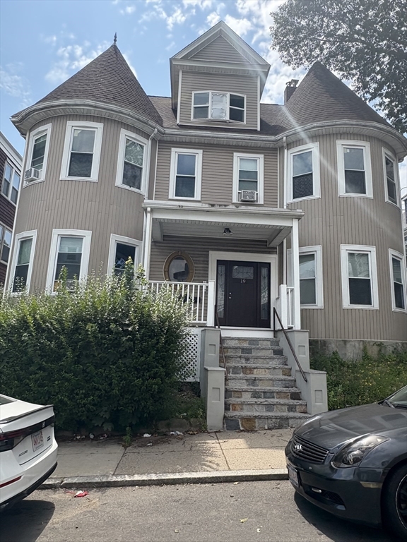 19 Wolcott Street, Unit 3 Boston, MA 02121 - Photo 2 of 17 a front view of a house with a yard
