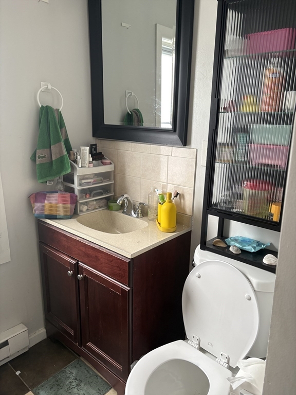19 Wolcott Street, Unit 3 Boston, MA 02121 - Photo 4 of 17 a bathroom with a sink toilet and mirror