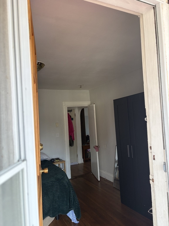 19 Wolcott Street, Unit 3 Boston, MA 02121 - Photo 8 of 17 a view of walk in closet with clothes and shoes