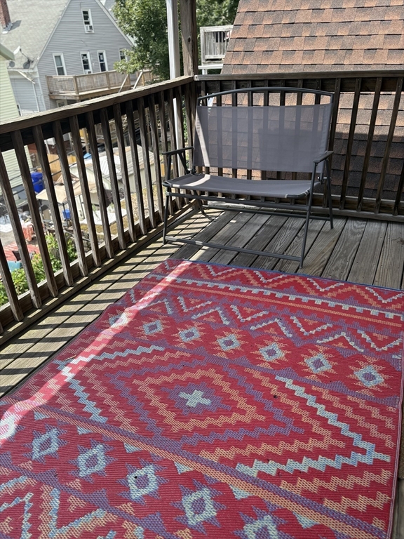 19 Wolcott Street, Unit 3 Boston, MA 02121 - Photo 9 of 17 a view of balcony with wooden floor