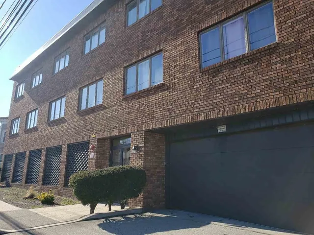 a front view of a house with yard
