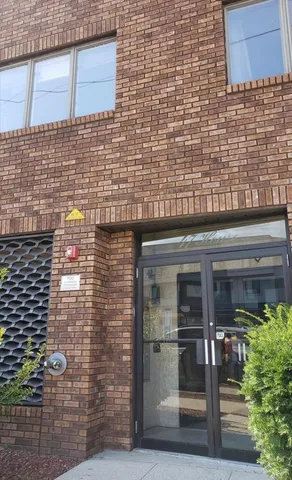 a bathroom with a sink and a potted plant