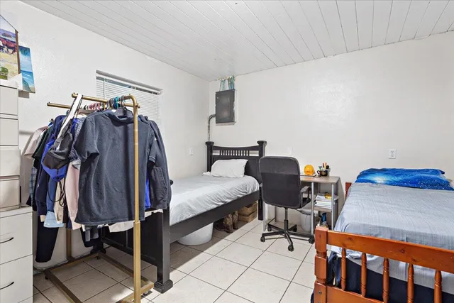 a bedroom with a bed and a closet