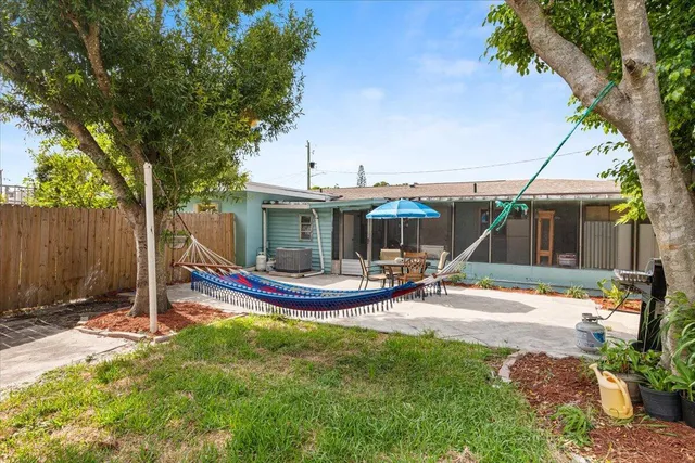 a view of an outdoor sitting area with furniture and backyard