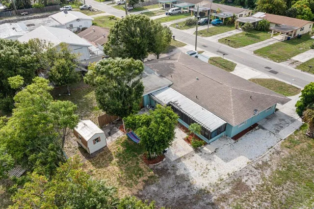an aerial view of a house with outdoor space