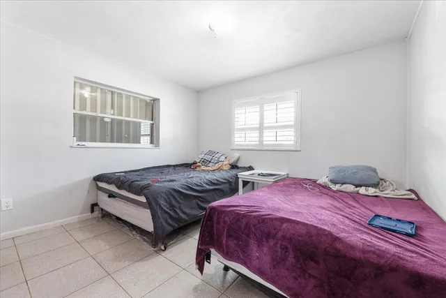 a bedroom with a bed and walk in closet