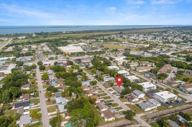 an aerial view of residential building with green space