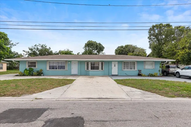 a view of a yard in front view of a house