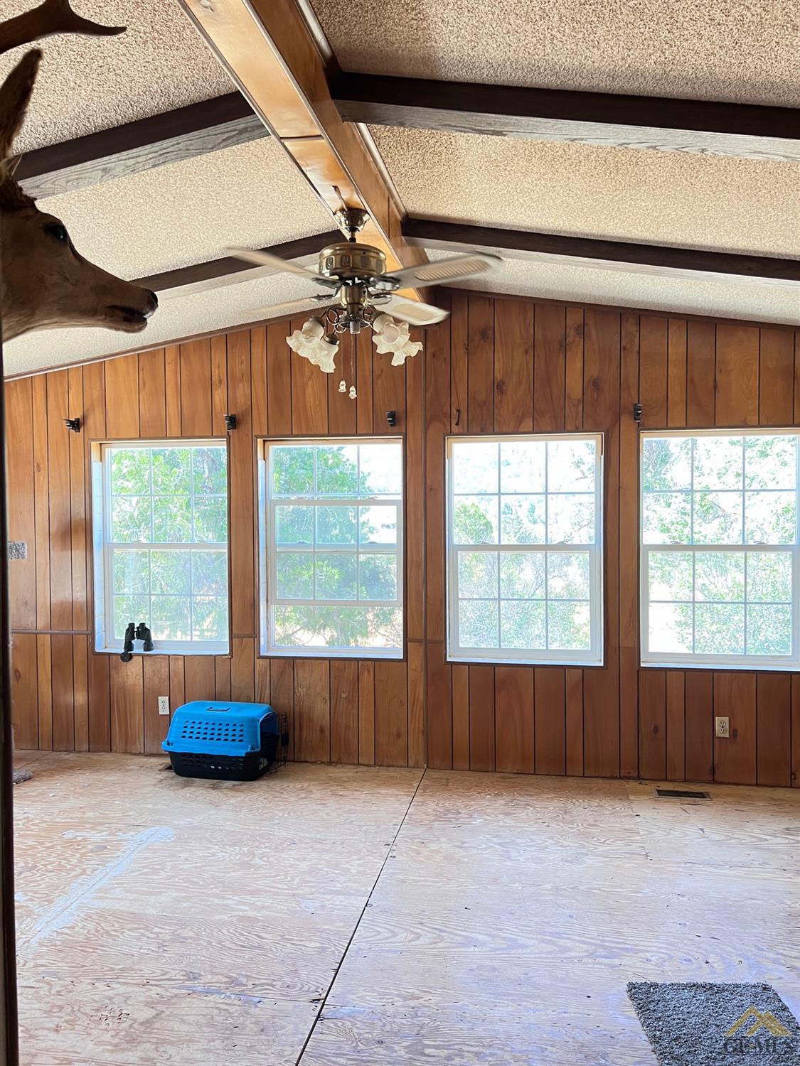 Undisclosed Address Caliente, CA 93518 - Photo 11 of 54 a view of an empty room with a window and chandelier