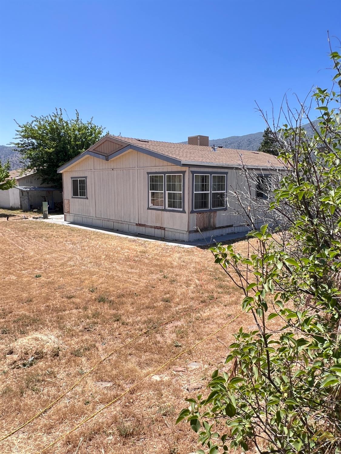 Undisclosed Address Caliente, CA 93518 - Photo 2 of 54 a view of a house with a yard