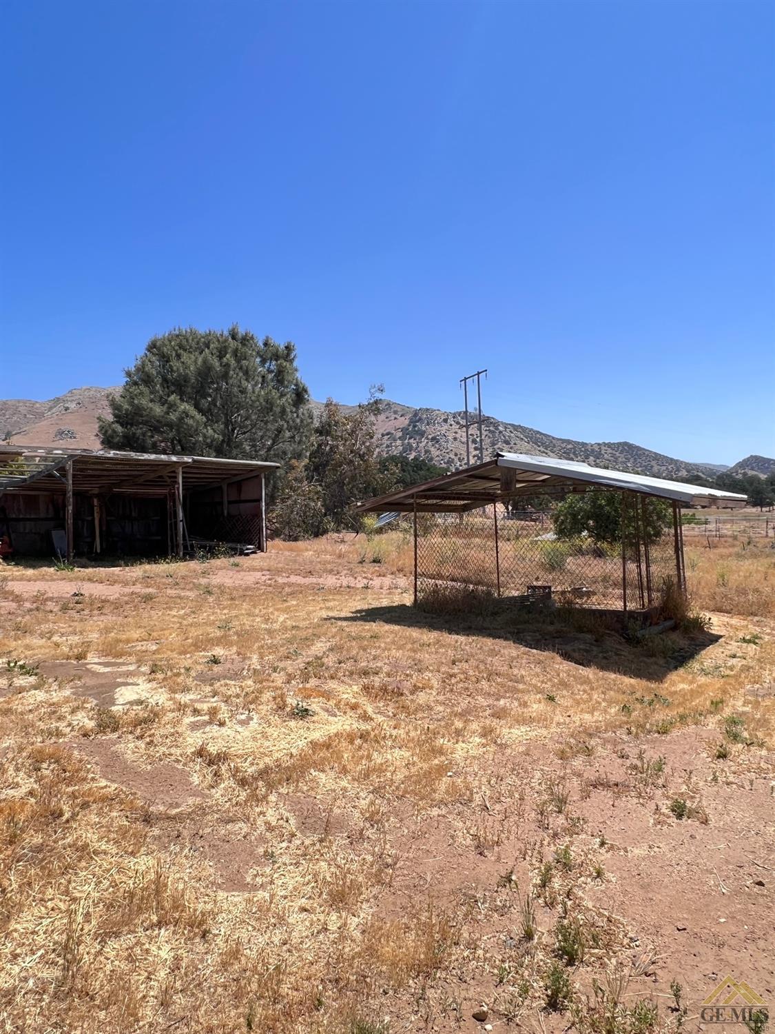 Undisclosed Address Caliente, CA 93518 - Photo 30 of 54 a front view of a house with a yard