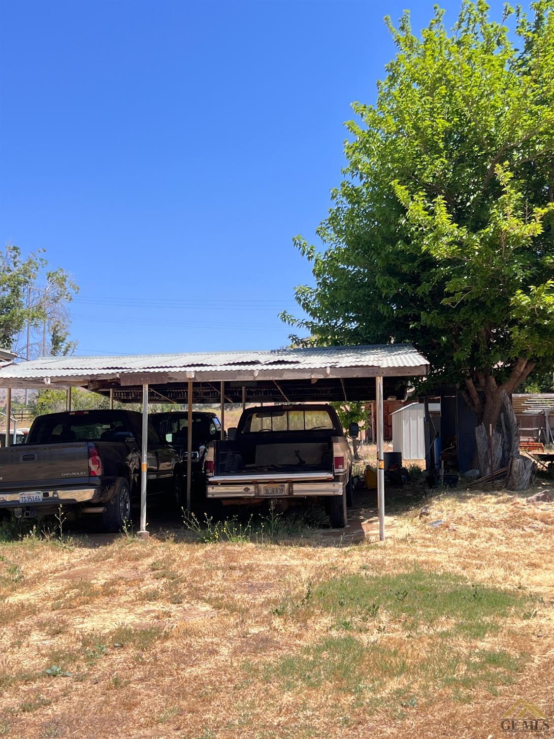 Undisclosed Address Caliente, CA 93518 - Photo 36 of 54 a view of a house with a backyard and a patio