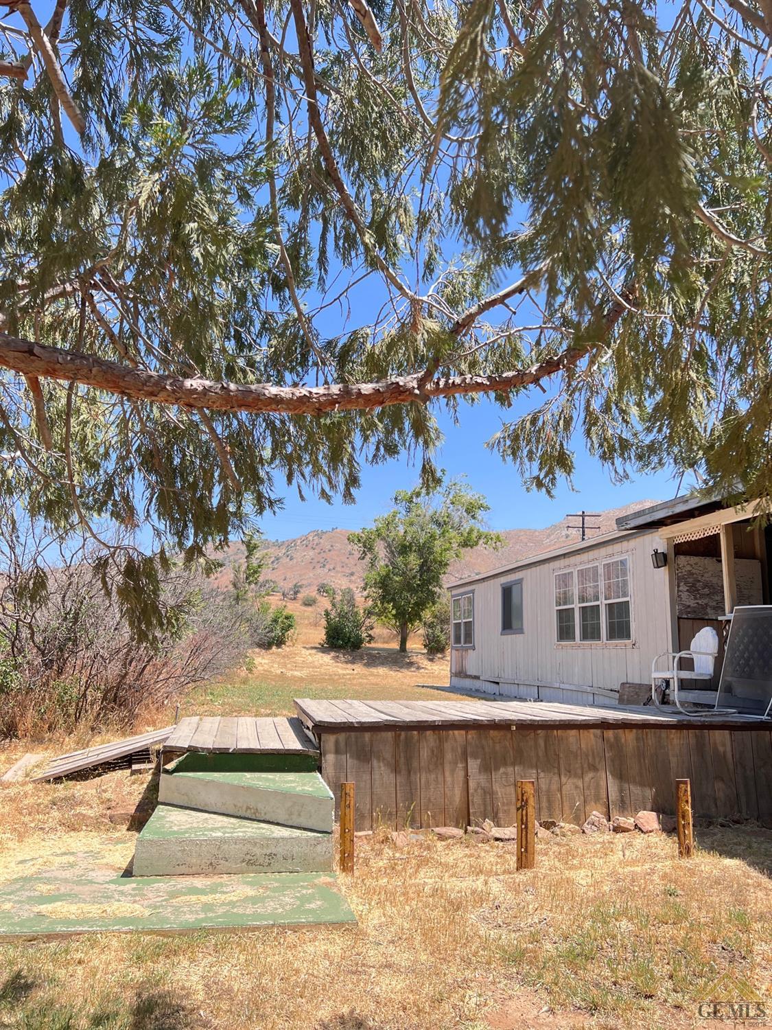 Undisclosed Address Caliente, CA 93518 - Photo 4 of 54 a view of a swimming pool with a yard