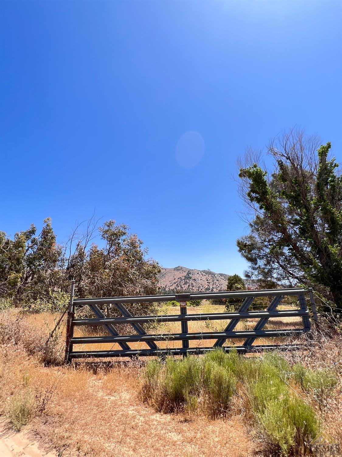 Undisclosed Address Caliente, CA 93518 - Photo 52 of 54 a view of a lake with houses in the back