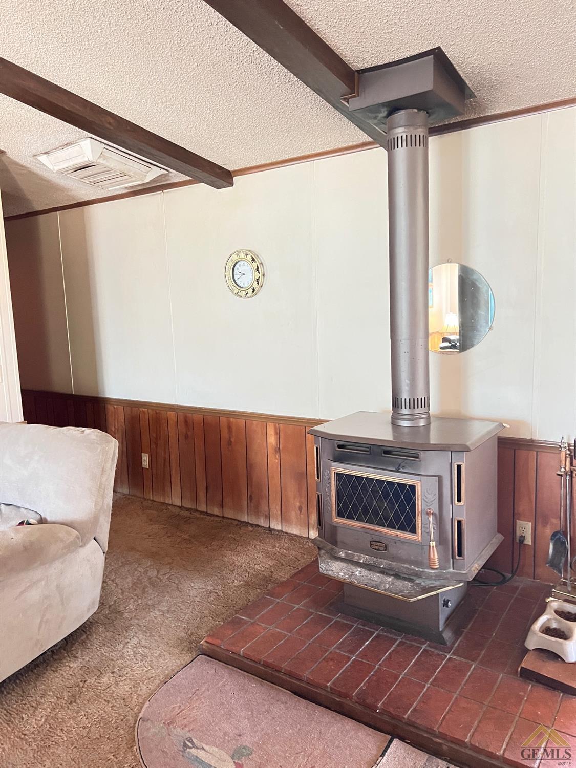 Undisclosed Address Caliente, CA 93518 - Photo 8 of 54 a living room with a couch and a fireplace