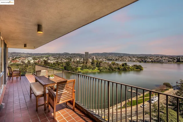a view of a balcony with city