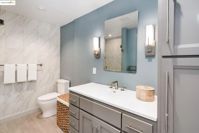 a bathroom with a sink a mirror and a shower