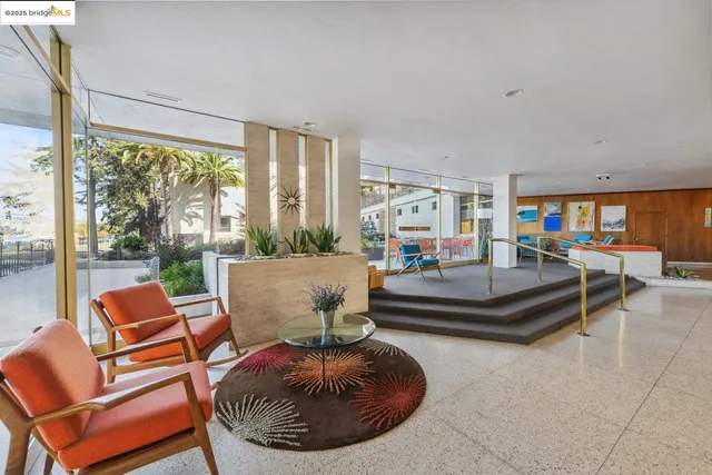 a lobby with furniture and outdoor space