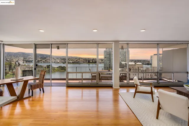a living room with hardwood floor and a table