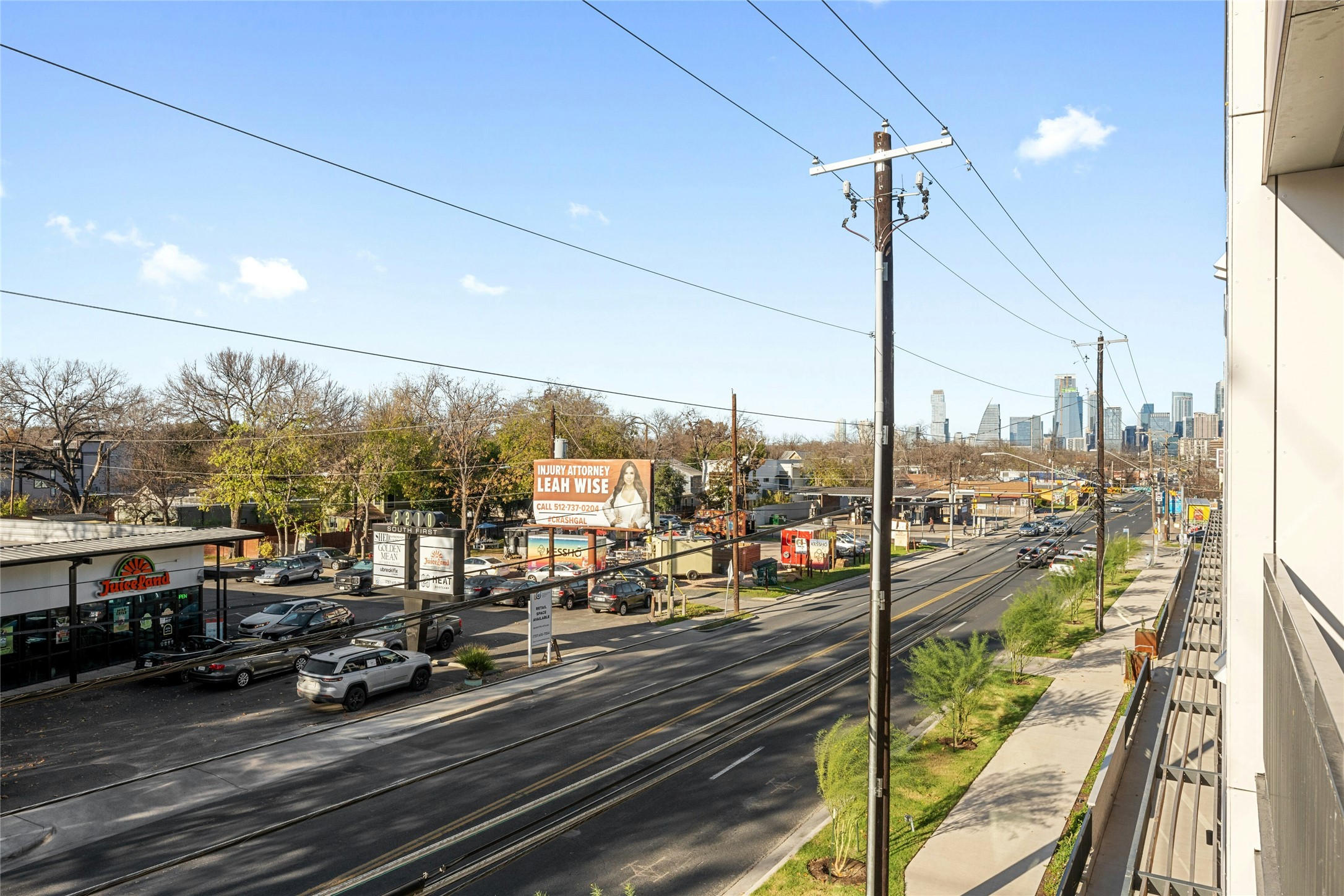 2209 South 1st Street, Unit 321 Austin, TX 78704 - Photo 27 of 40 View of asphalt road featuring sidewalks, curbs, and a view of city
