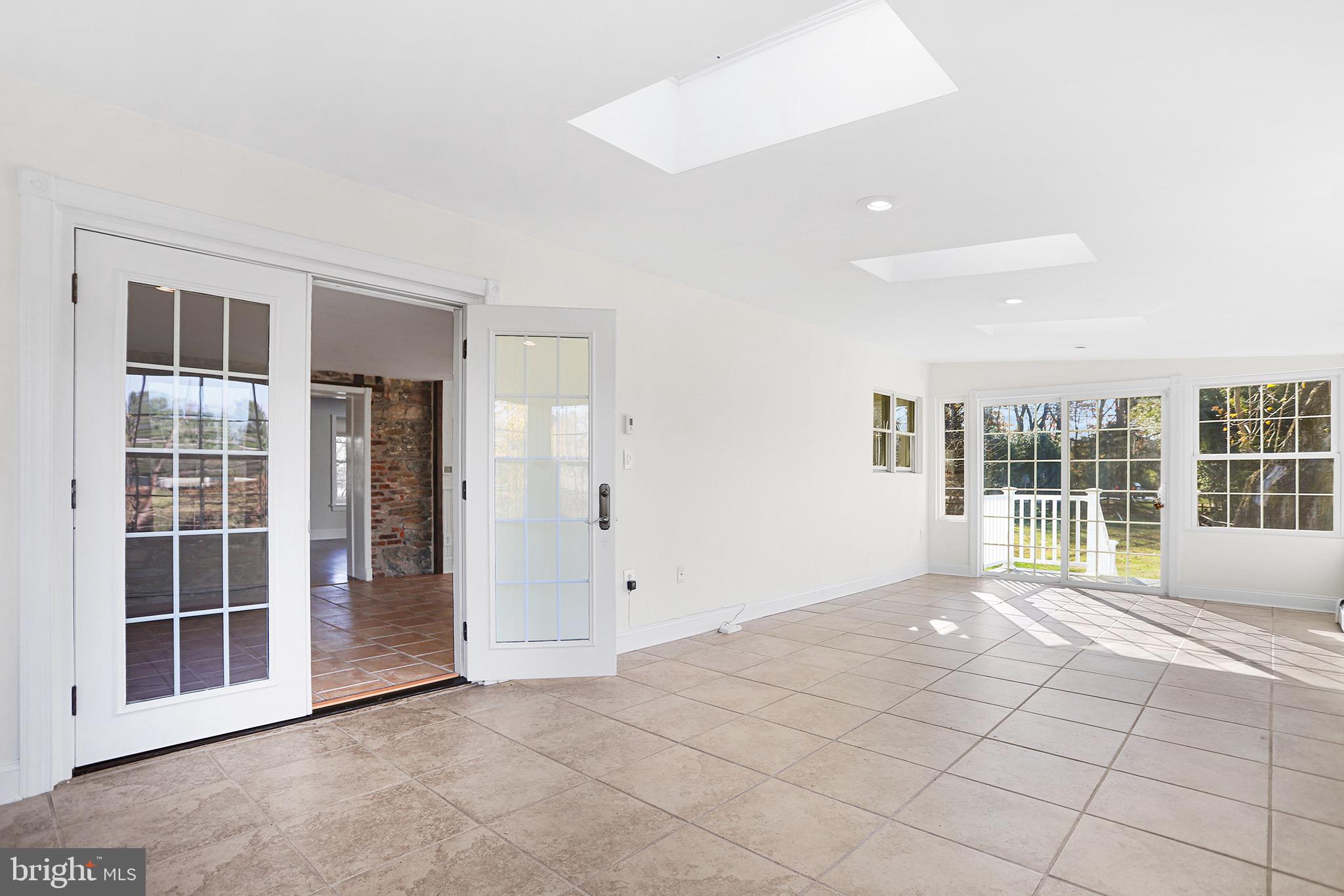 1185 West Street Road West Chester, PA 19382 - Photo 5 of 43 an empty room with windows