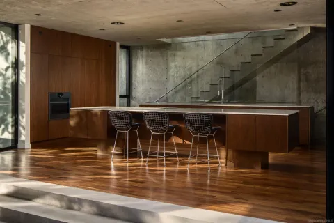 a view of a dining room with furniture and window
