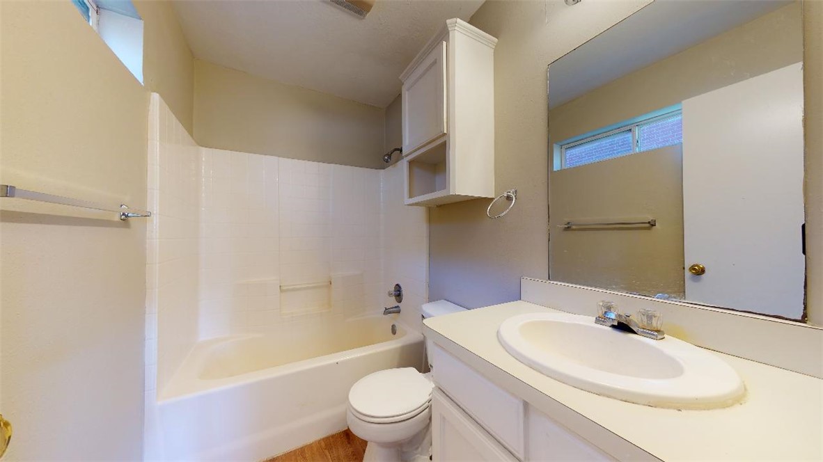 1511 Hollow Hill Drive, Unit B Bryan, TX 77802 - Photo 13 of 22 a bathroom with a sink a toilet and a bathtub