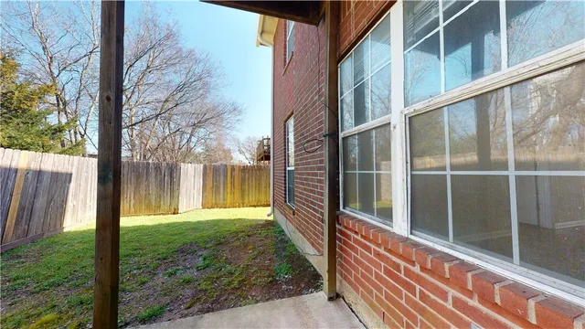 a view of a back yard from a balcony
