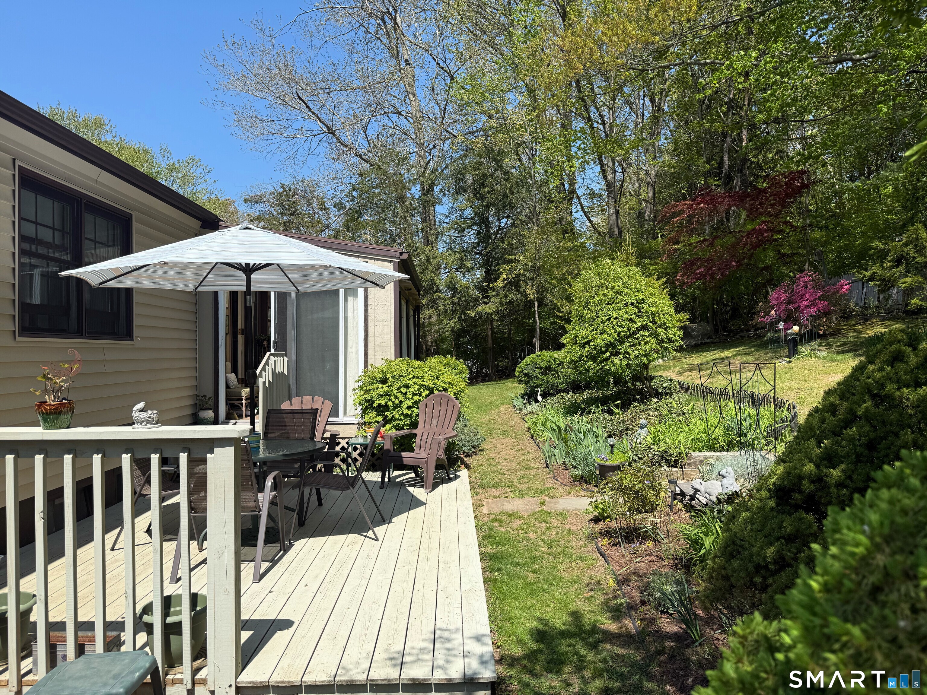 15 Grove Street Deep River, CT 06417 - Photo 3 of 25 a view of a patio with table and chairs and potted plants