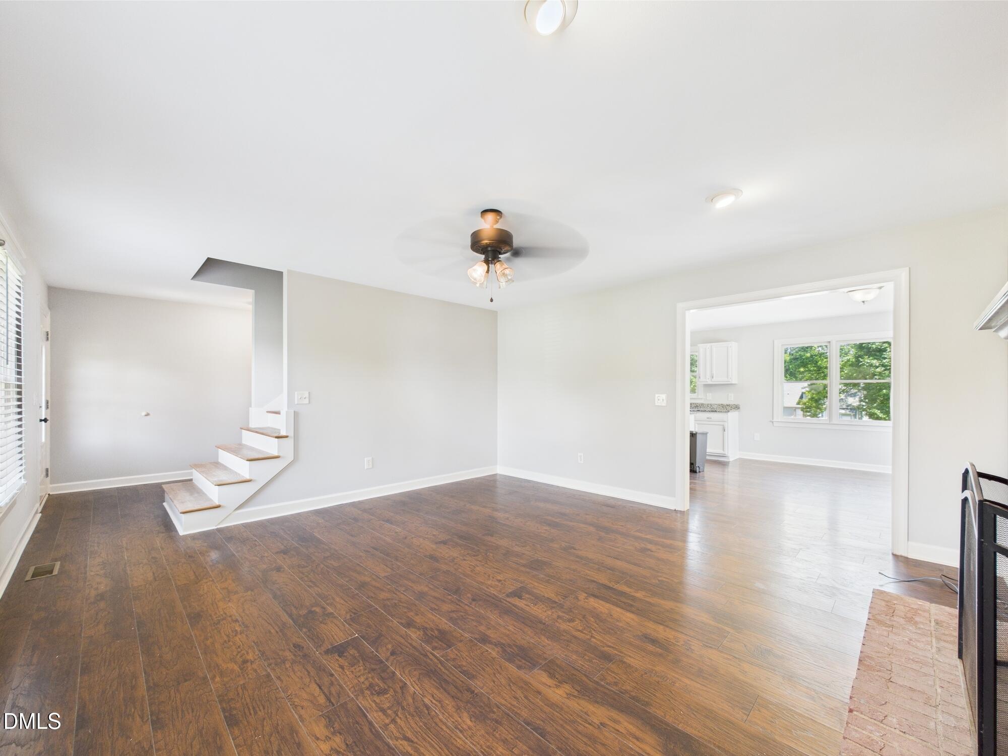 10917 Fanny Brown Road Raleigh, NC 27603 - Photo 14 of 54 a view of empty room with wooden floor and fan