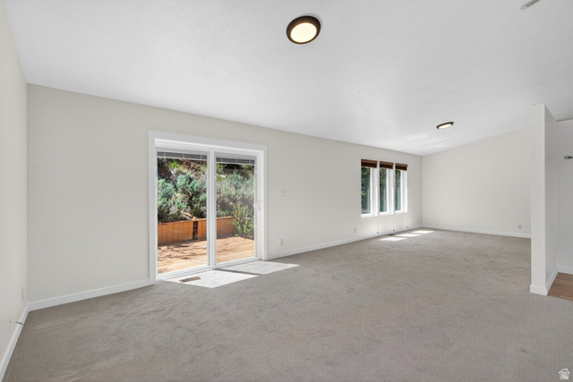 380 Luzern Road Midway, UT 84049 - Photo 20 of 74 Expansive room featuring light gray carpet flooring and white painted walls