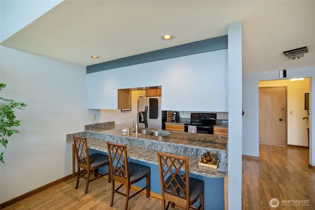 a kitchen with a table and chairs in it