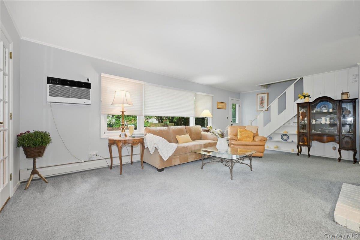 16 Ridge Drive East Roslyn, NY 11576 - Photo 15 of 40 a living room with furniture and a table