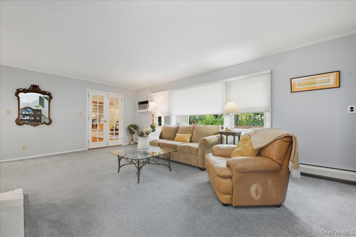 16 Ridge Drive East Roslyn, NY 11576 - Photo 17 of 40 a living room with furniture and a window