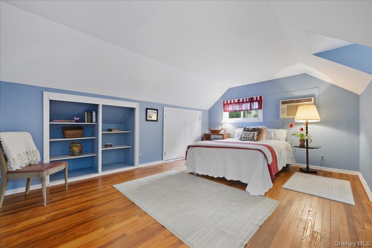 16 Ridge Drive East Roslyn, NY 11576 - Photo 31 of 40 a bedroom with a bed and closet