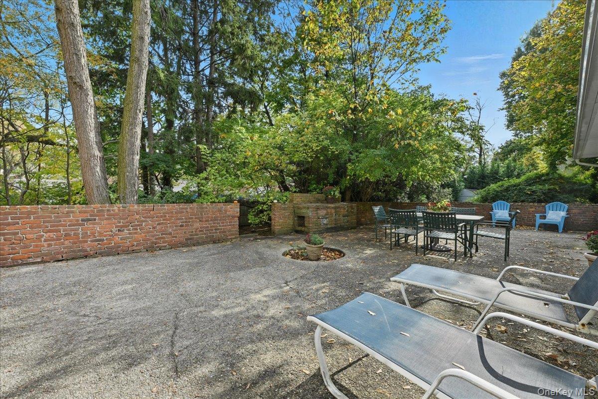 16 Ridge Drive East Roslyn, NY 11576 - Photo 38 of 40 a backyard of a house with seating space