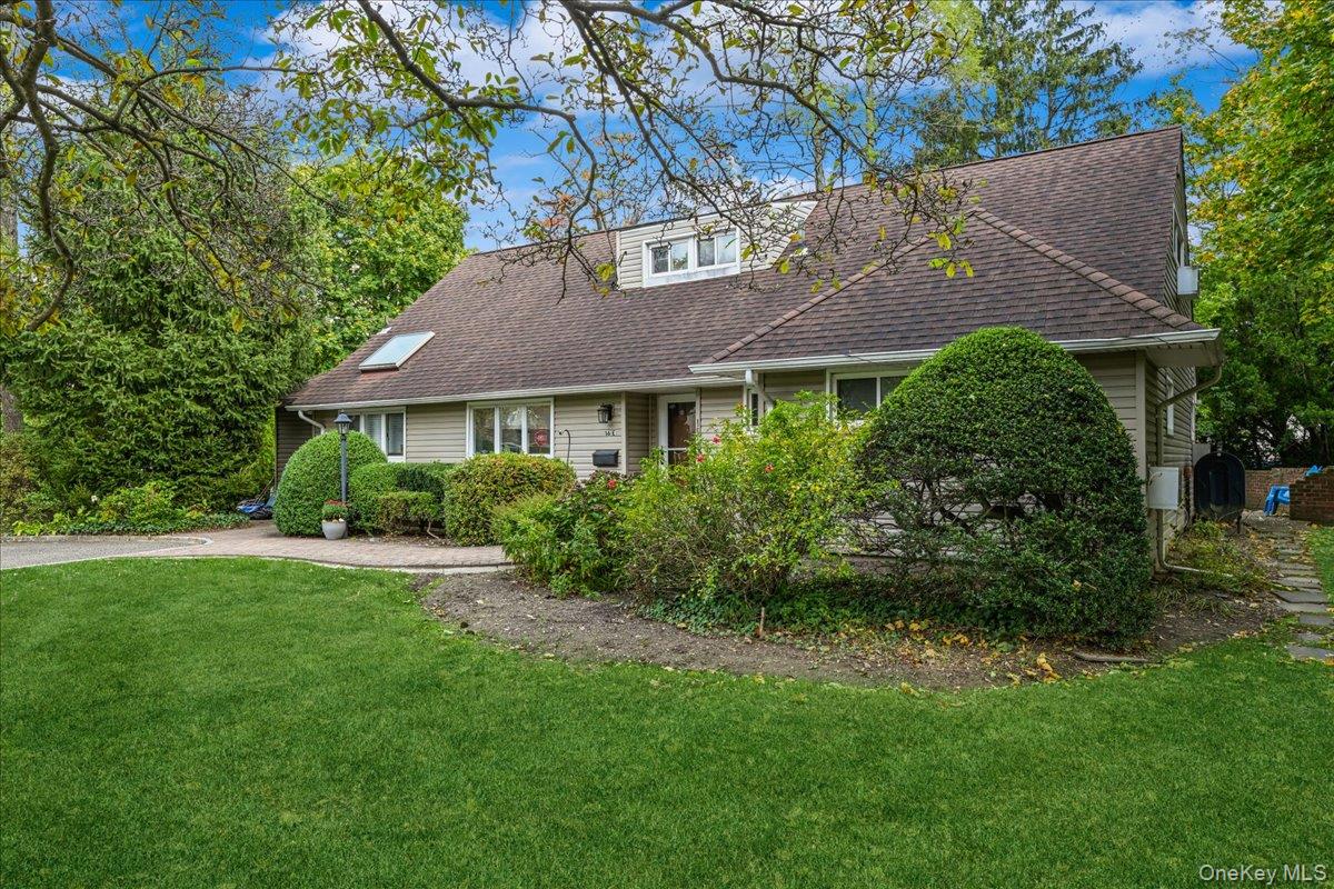 16 Ridge Drive East Roslyn, NY 11576 - Photo 4 of 40 a aerial view of a house next to a yard