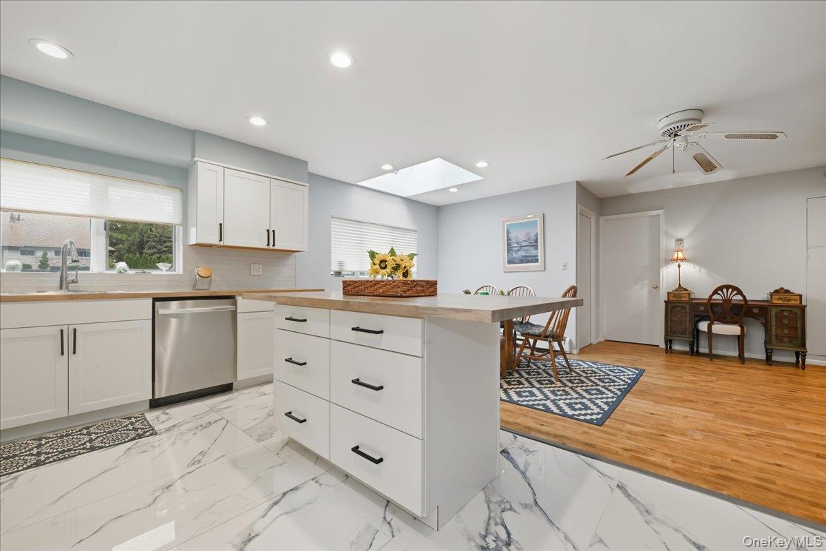 16 Ridge Drive East Roslyn, NY 11576 - Photo 7 of 40 a kitchen with sink cabinets and window