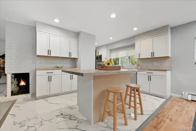 a kitchen with a stove a sink and a refrigerator