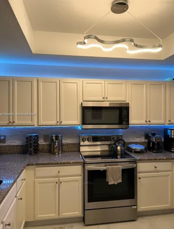 a kitchen with a stove and a microwave