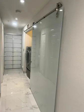 a bathroom with a sink mirror vanity and toilet