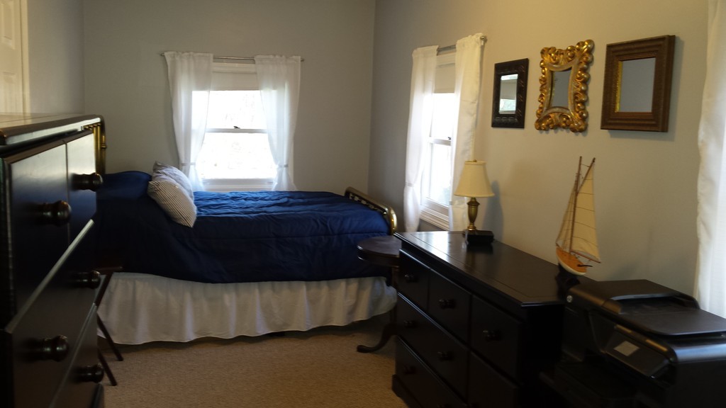 68 Indian Lane Canton, MA 02021 - Photo 7 of 10 a bedroom with a bed window and dresser