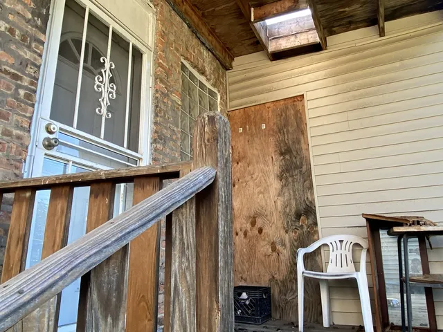 a view of balcony with furniture